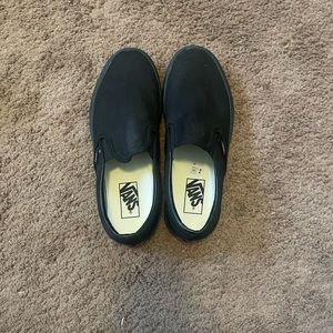 All black slip on vans